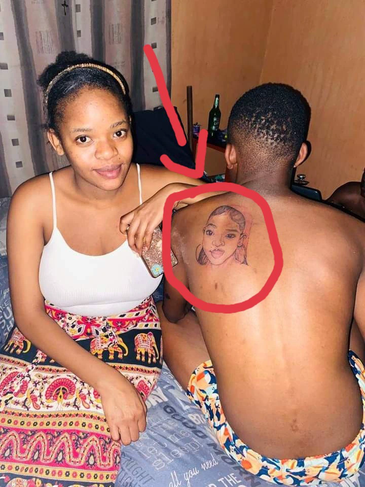" 1 Man Down " - Reactions As Man Tattoos Face Of His Girlfriend At His Back - Photos
