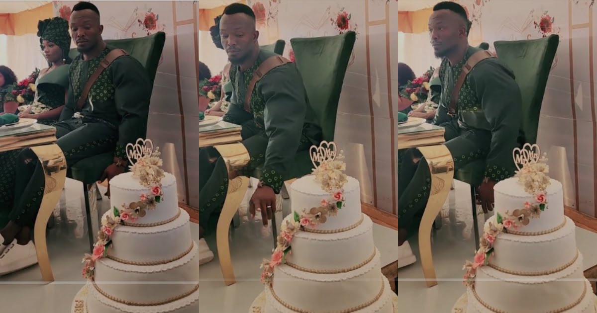 Hilarious moment Groom Attempts Eating His Wedding Cake Before it Was Cut (Video)