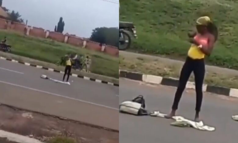 Lady goes crazy after she was dropped in the middle of the road by a yahoo boy. (watch video)